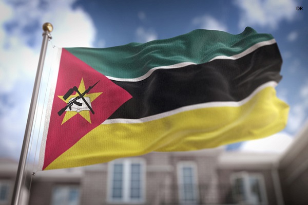 Mozambique Flag 3D Rendering on Blue Sky Building Background